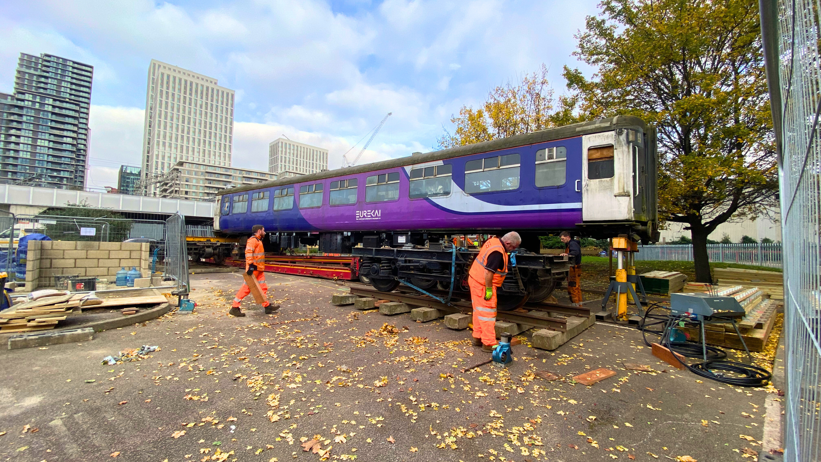 Wider shot of the train carriage, situated next to Stratford Station's DLR platform.