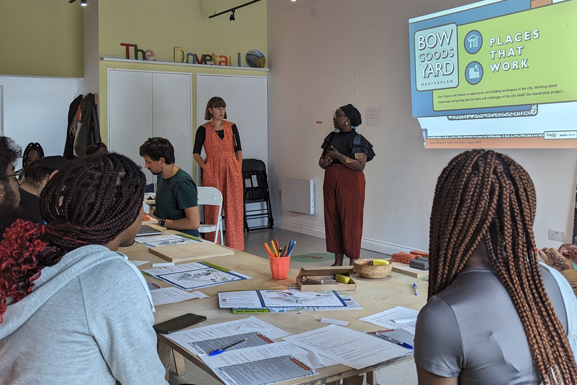 Young people listening into a presentation at the Dovetail Community centre